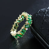 Baguette Cut Uneven Ring with Green Stones