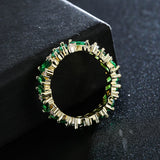 Baguette Cut Uneven Ring with Green Stones